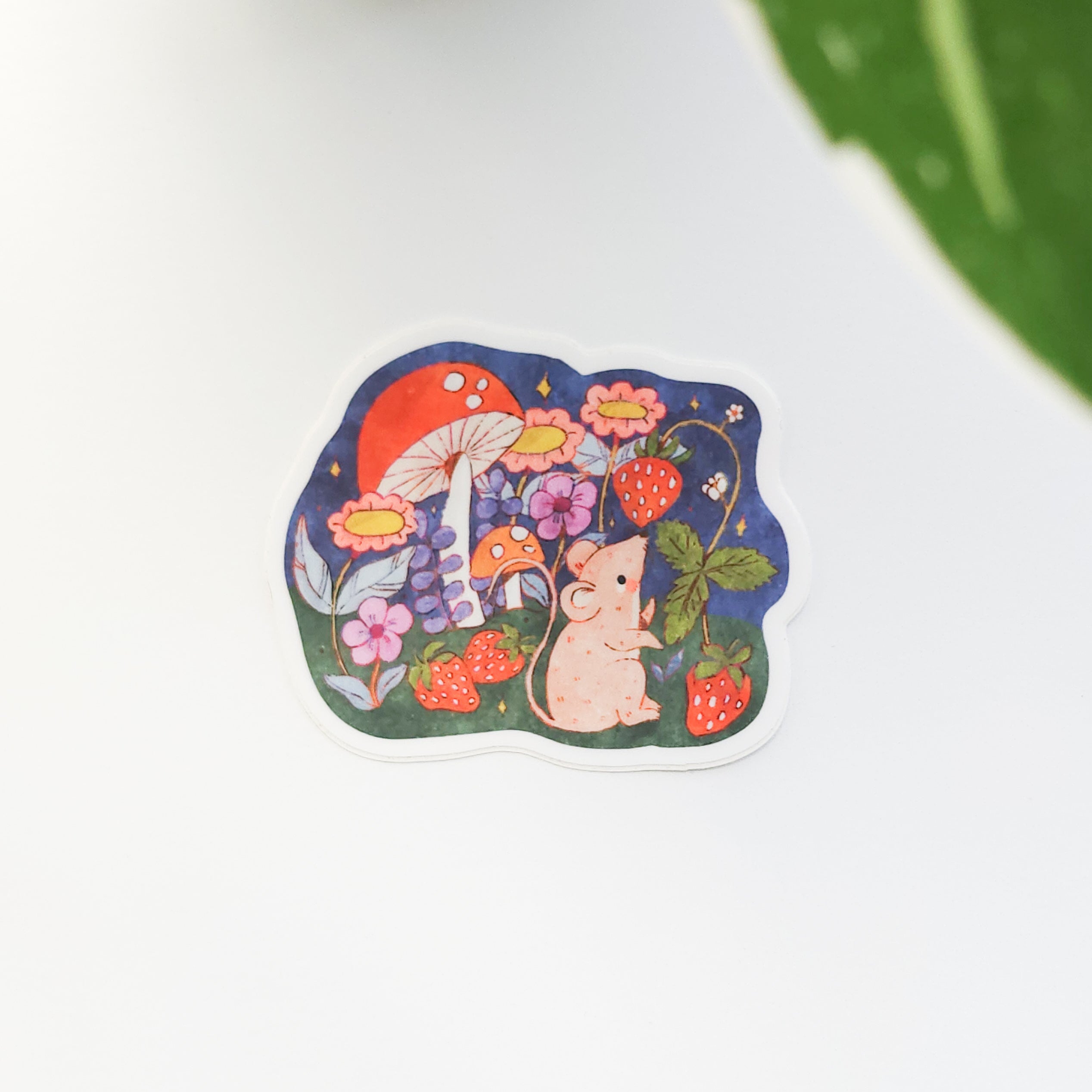 Sticker with a mouse, flowers, and strawberries on a white background