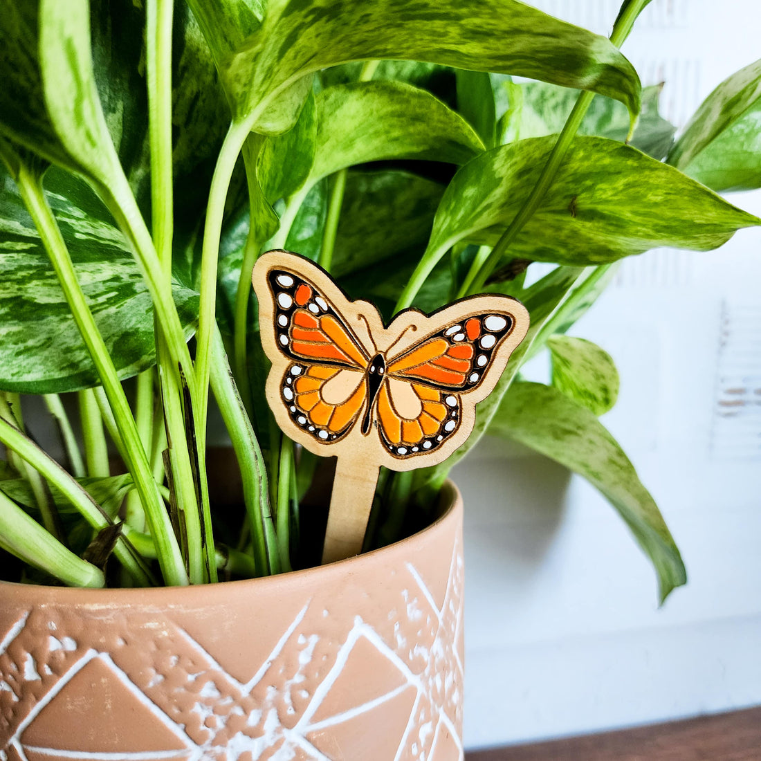 butterfly plant pick in a plant