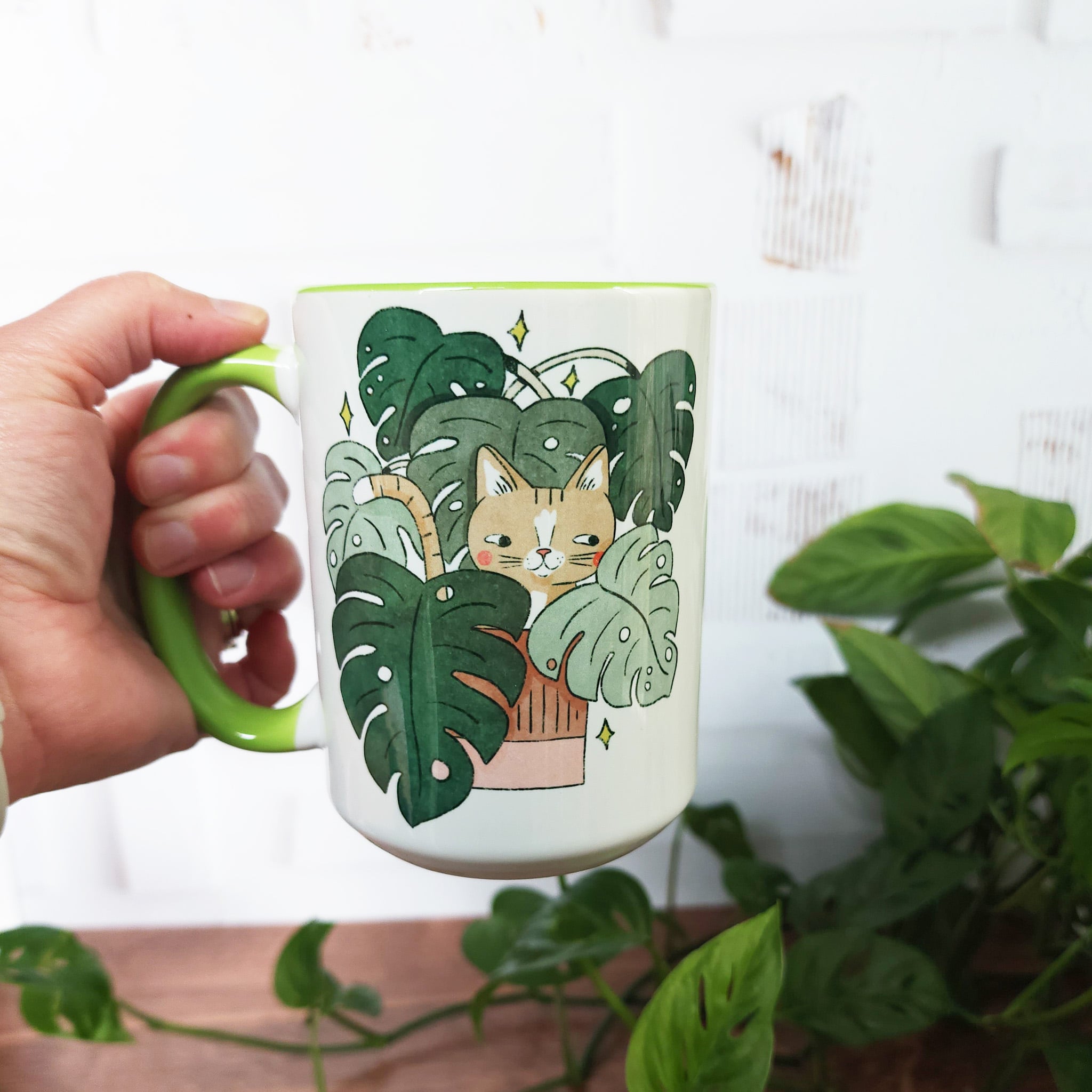 cat in monstera mug