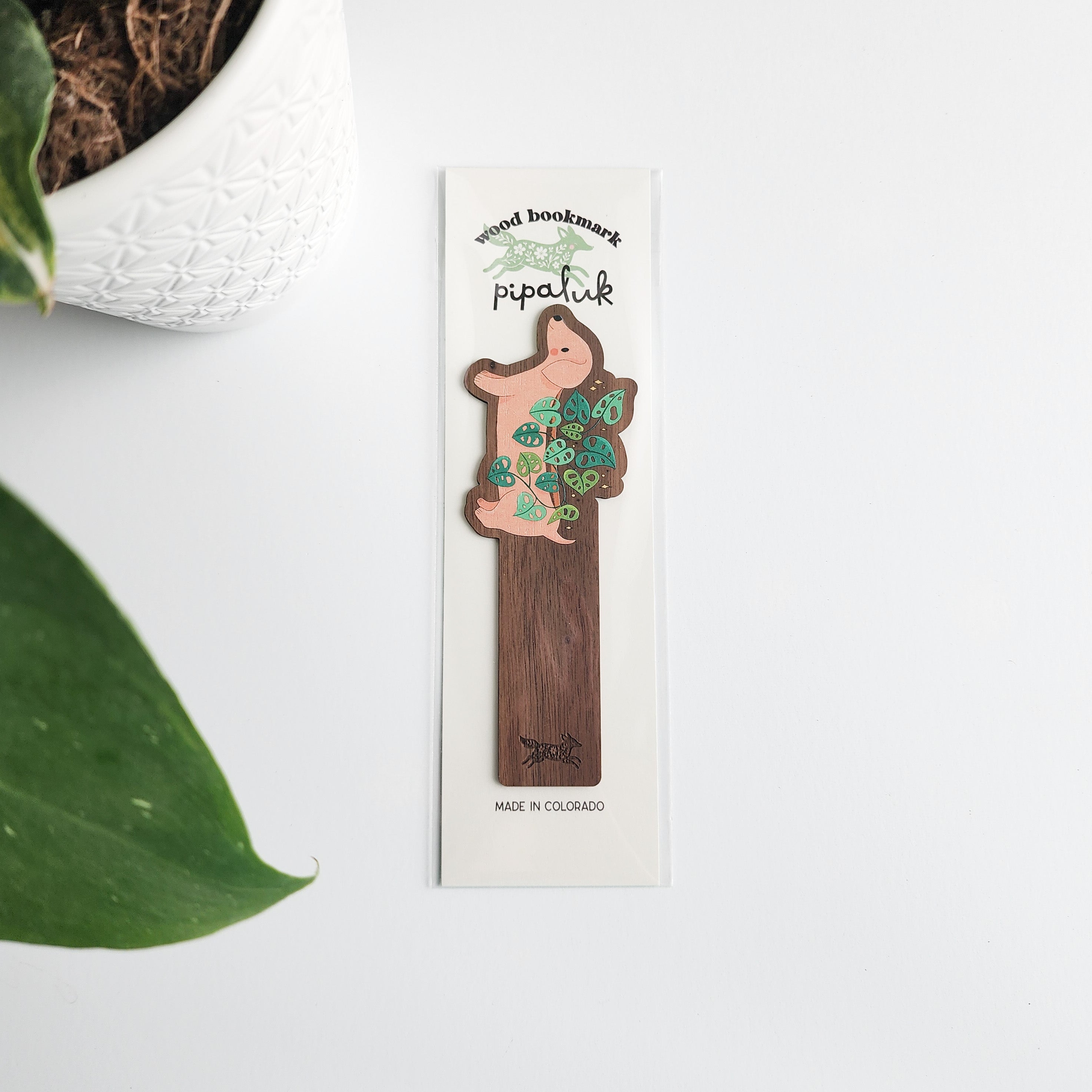 Wooden bookmark with dachshund planter, packaged in pipaluk packaging on a white background