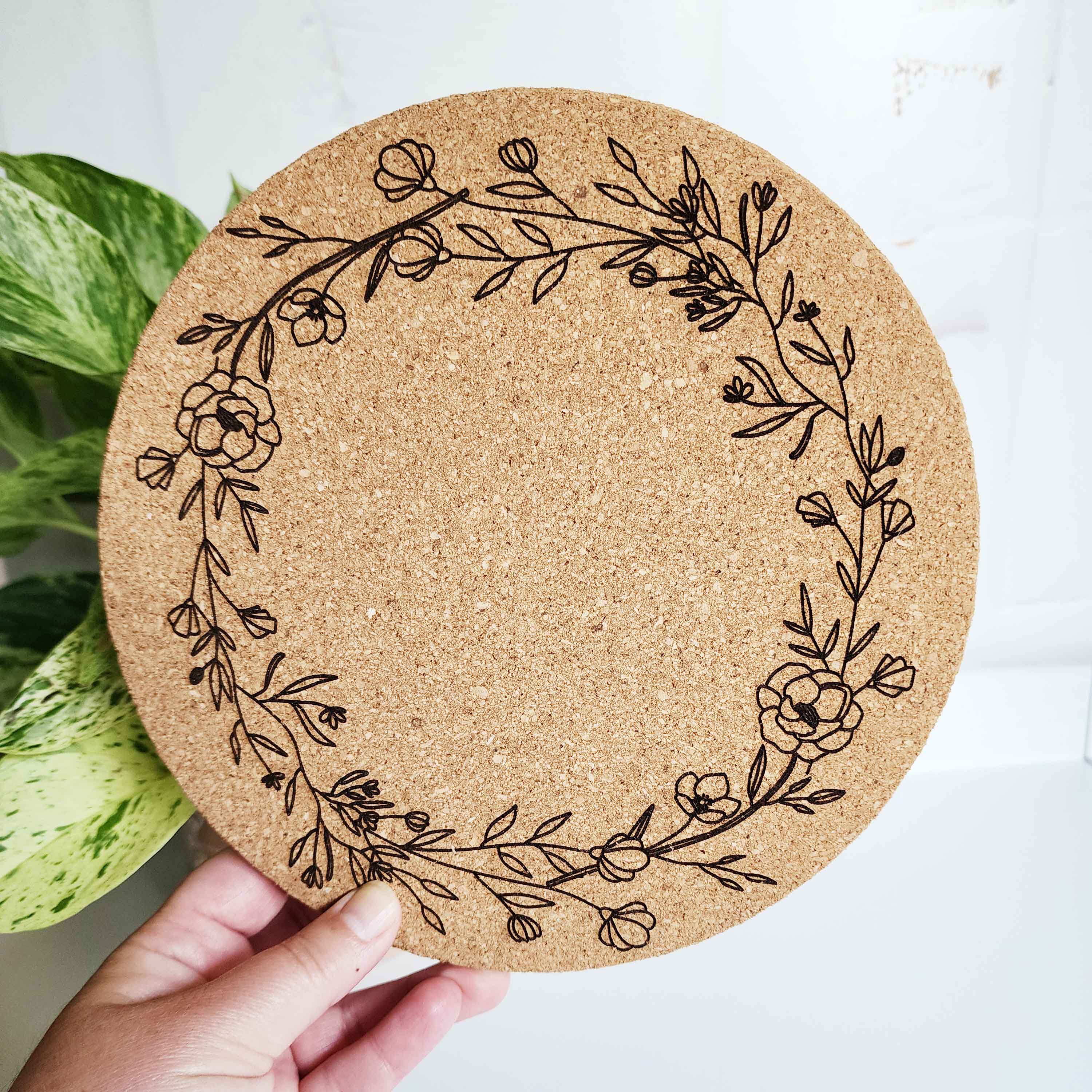circular floral wreath design on a cork trivet