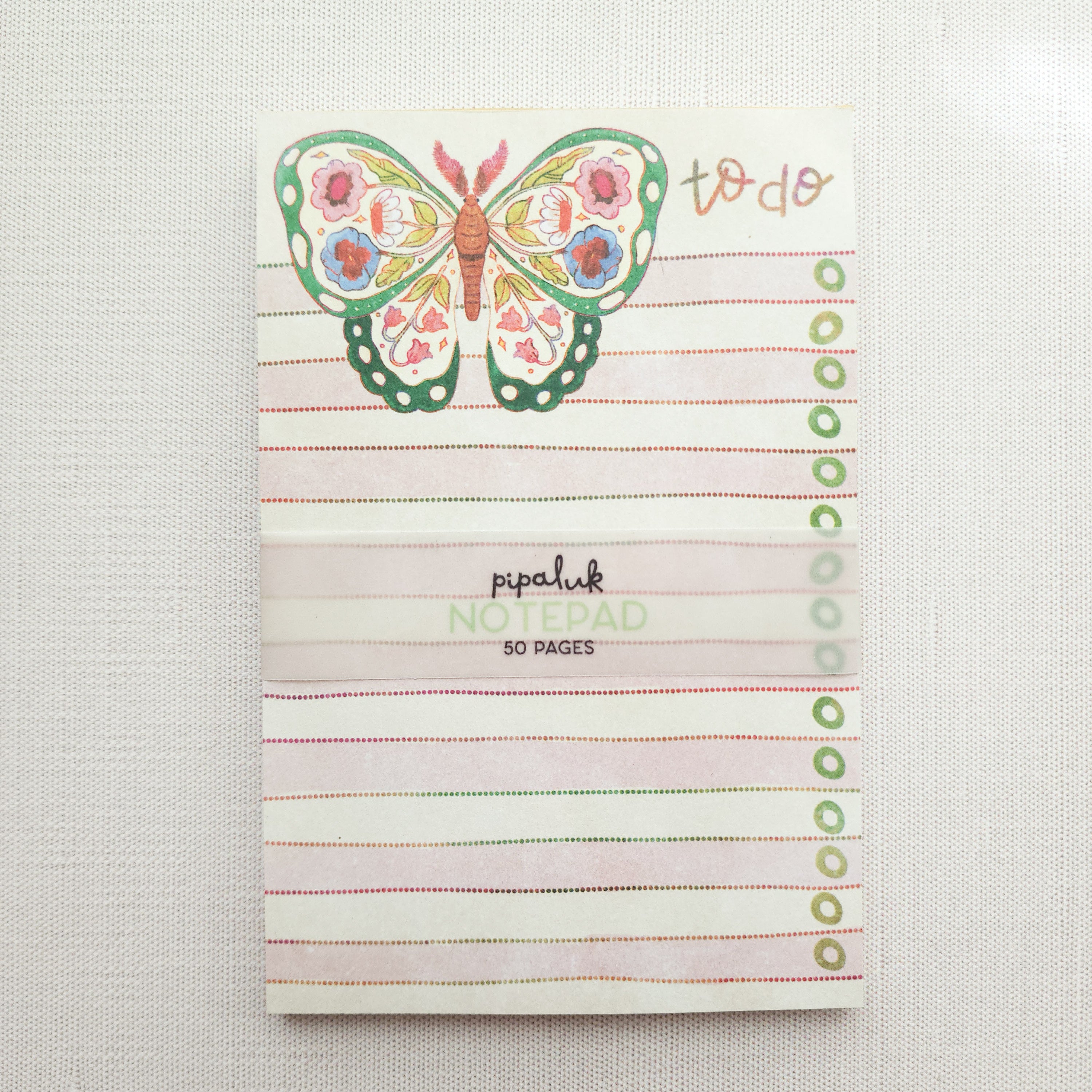 notepad with a floral butterfly illustration and the words to do