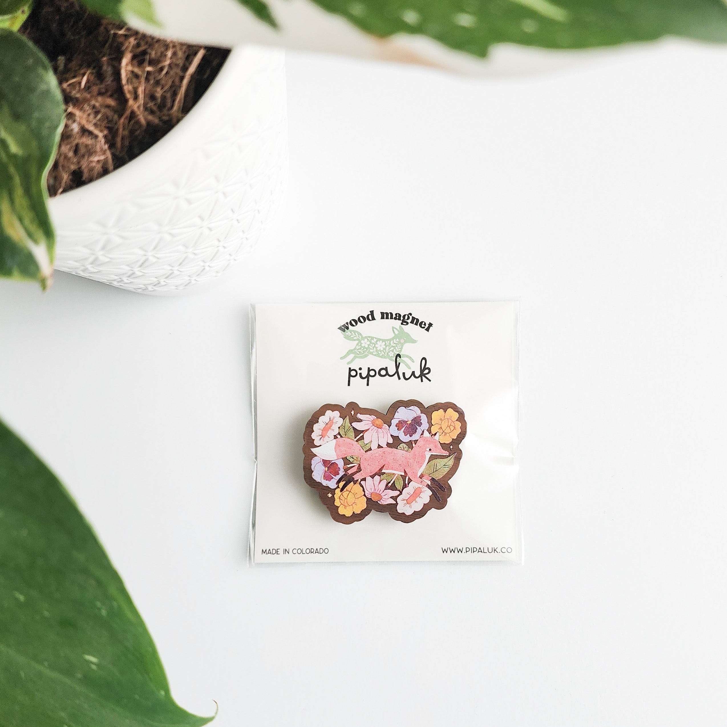 floral fox magnet in pipaluk packaging on a white background with a leaf