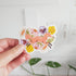 vinyl sticker with a fox jumping through blooming flowers