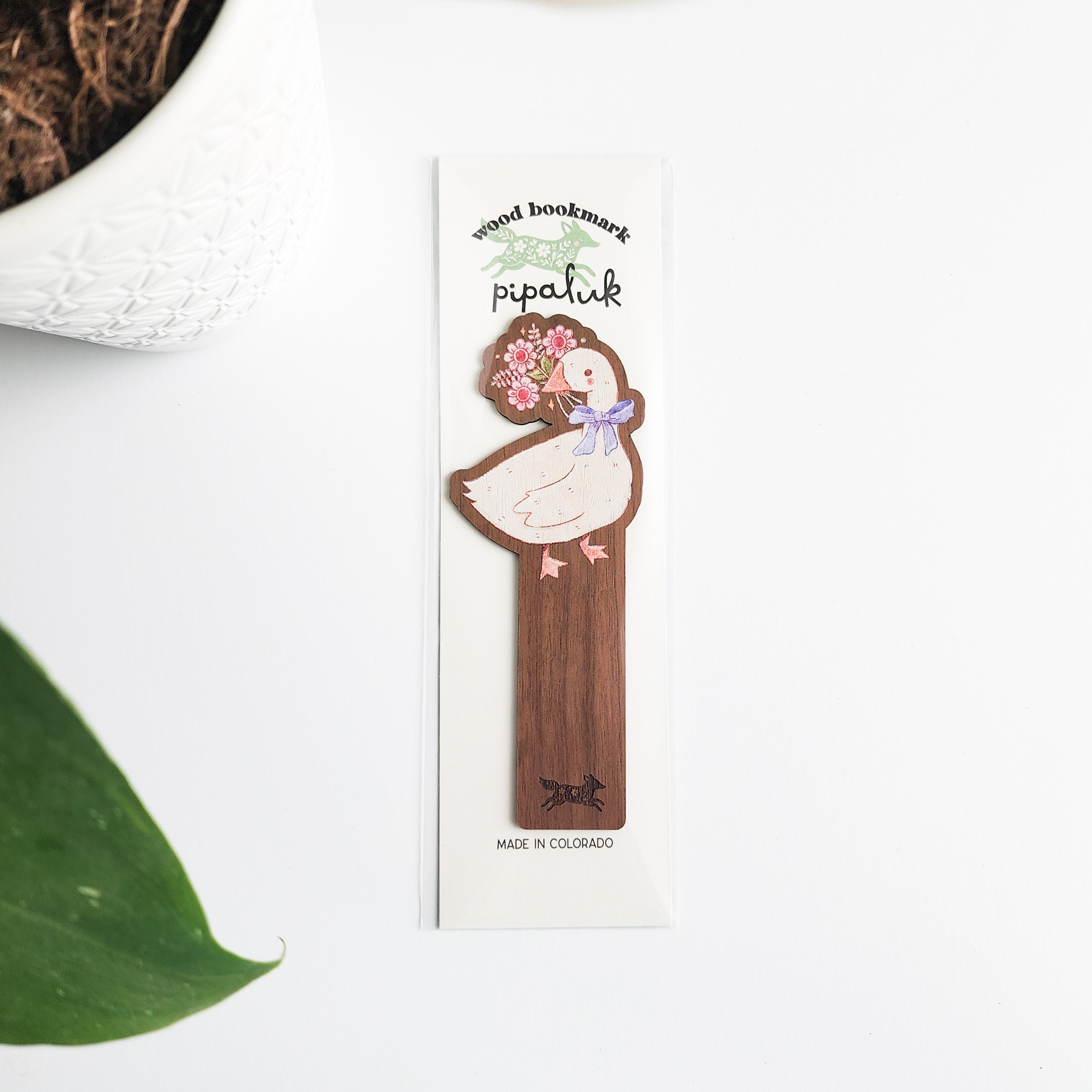 decorative goose bookmark in pipaluk packagin on a white background with leaves