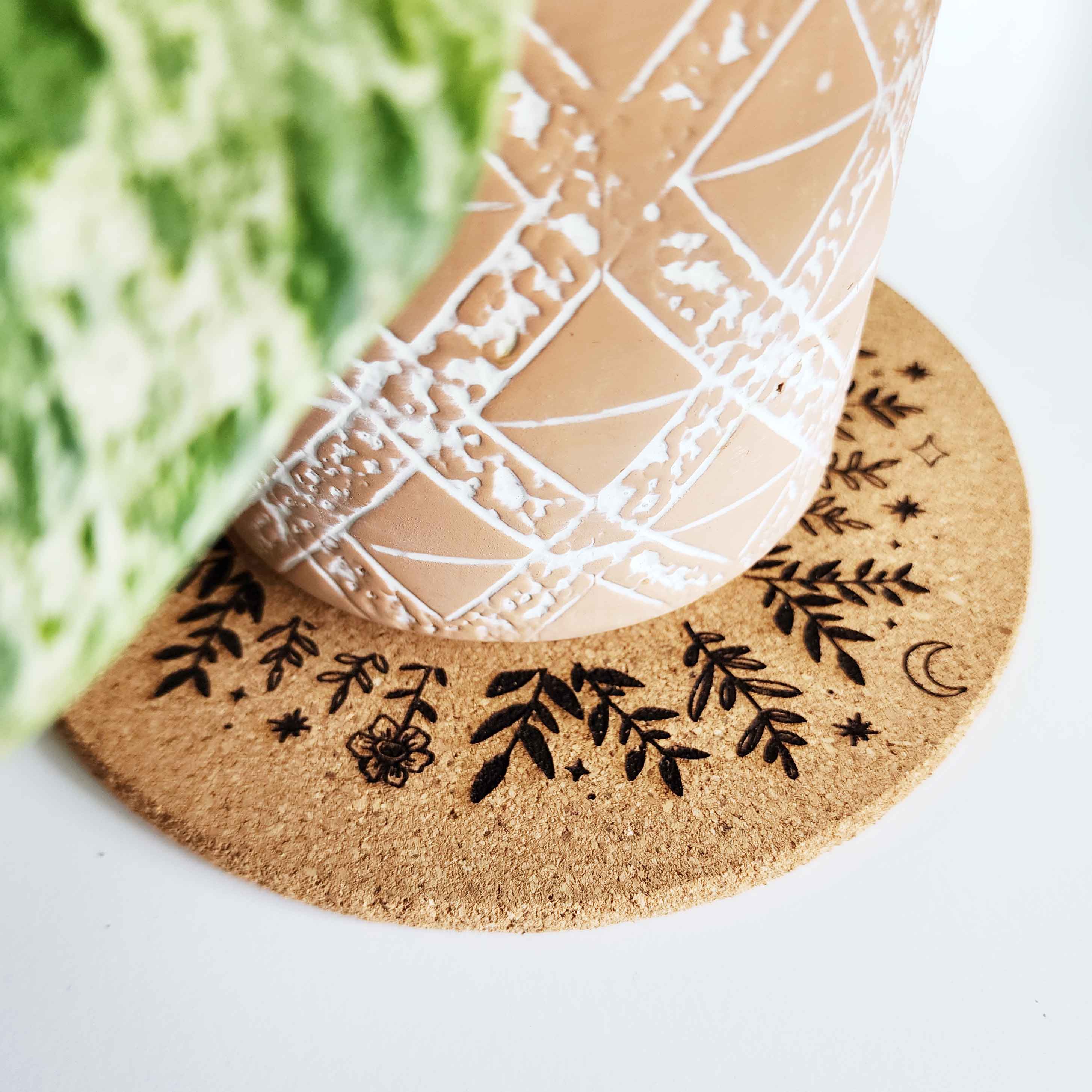 plant trivet with plants, stars and moons engrave on it