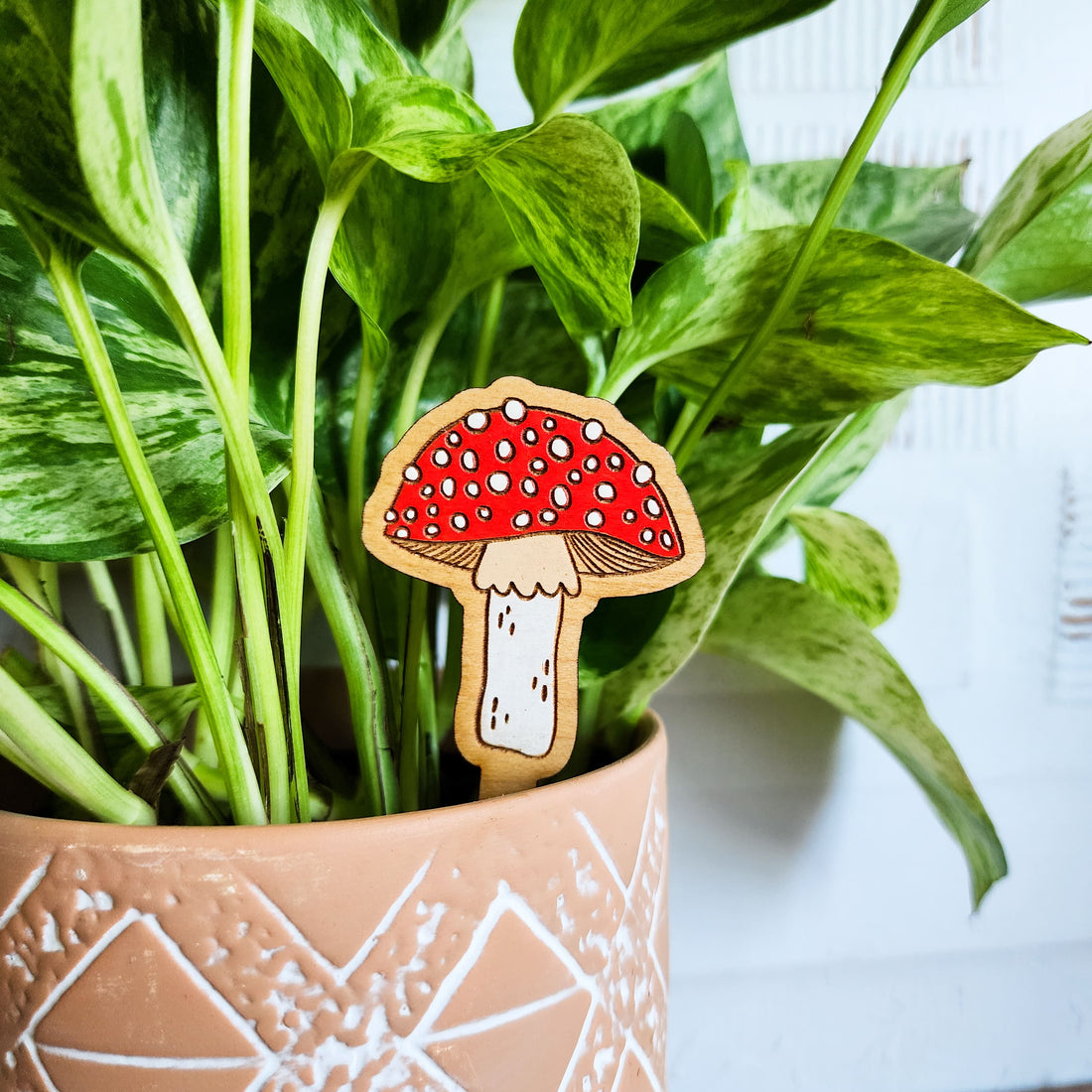 mushroom plant pick in a plant