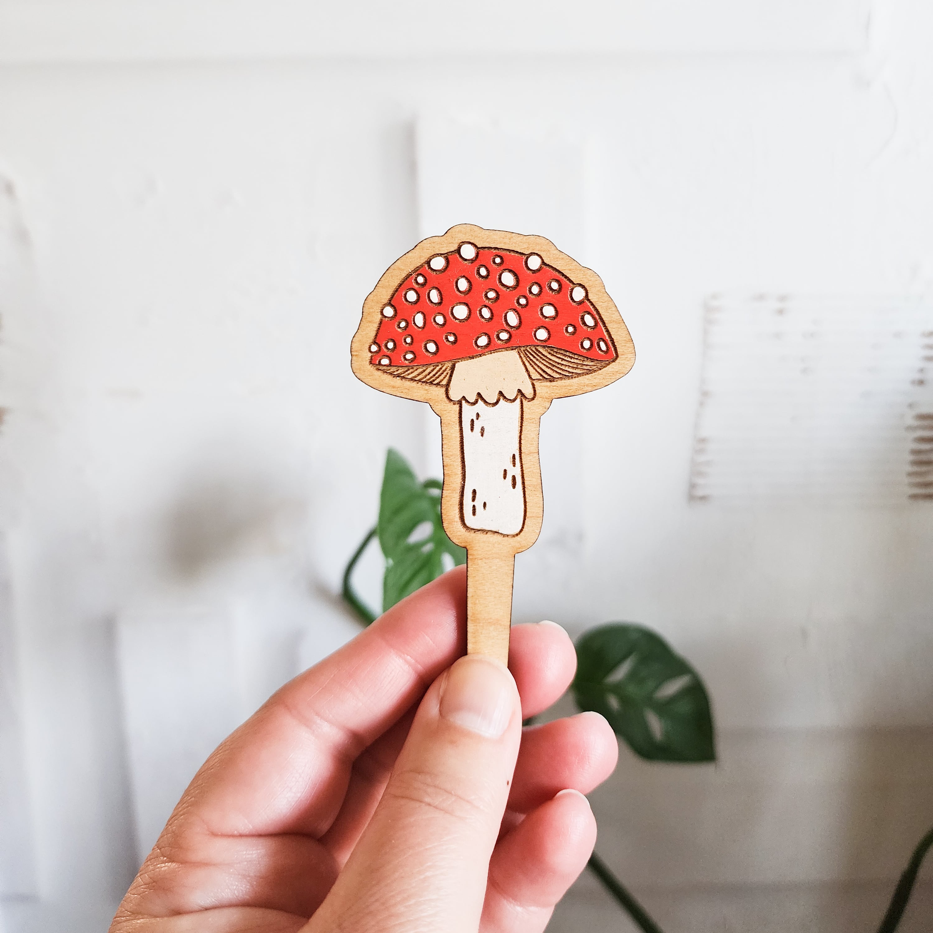 mushroom plant pick held in hand