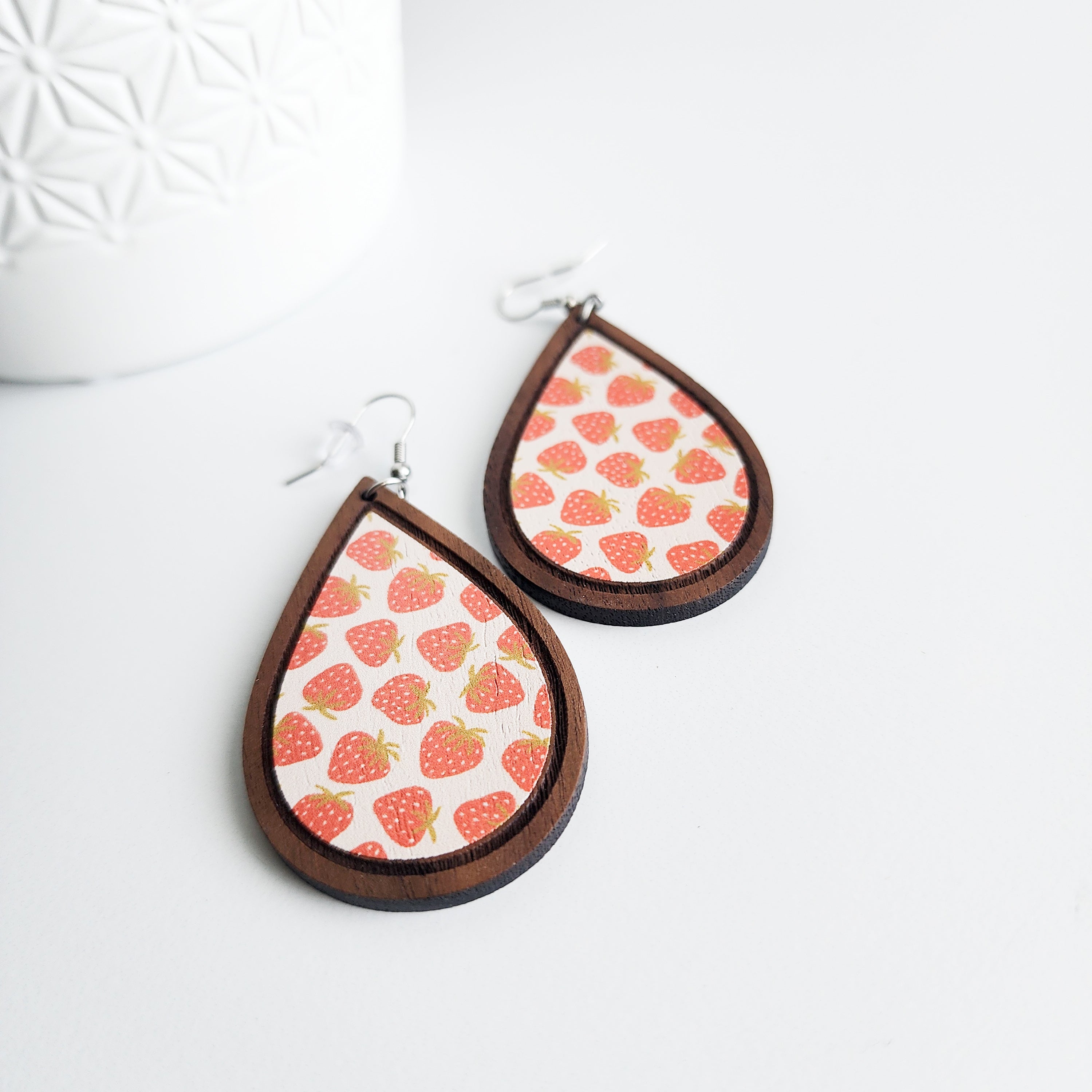 strawberry earrings on a white background