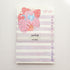 notepad with purple and white stripes and an illustration of a cat in a monstera plant and the words to do