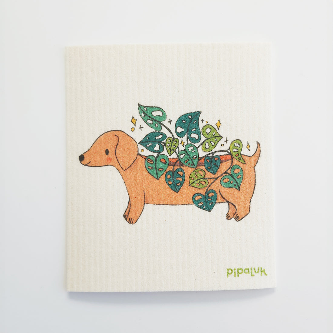 dishcloth with an image of a dachshund planter with a cheese plant growing out of its back