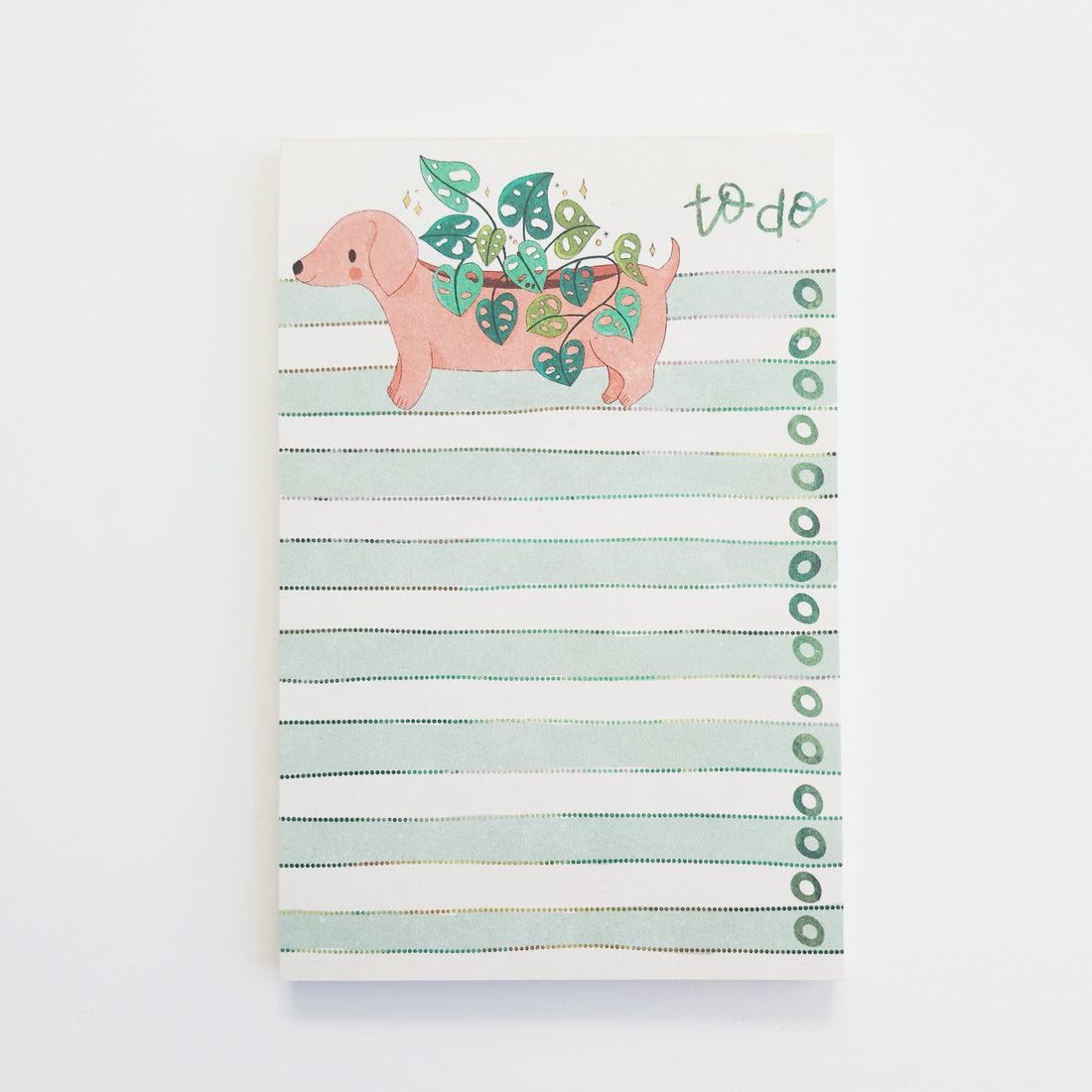 Notepad with a dachshund illustration and &
