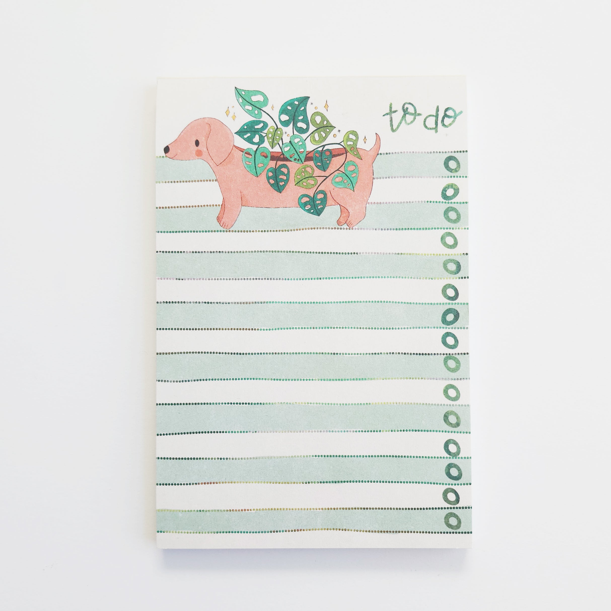 Notepad with a dachshund illustration and &