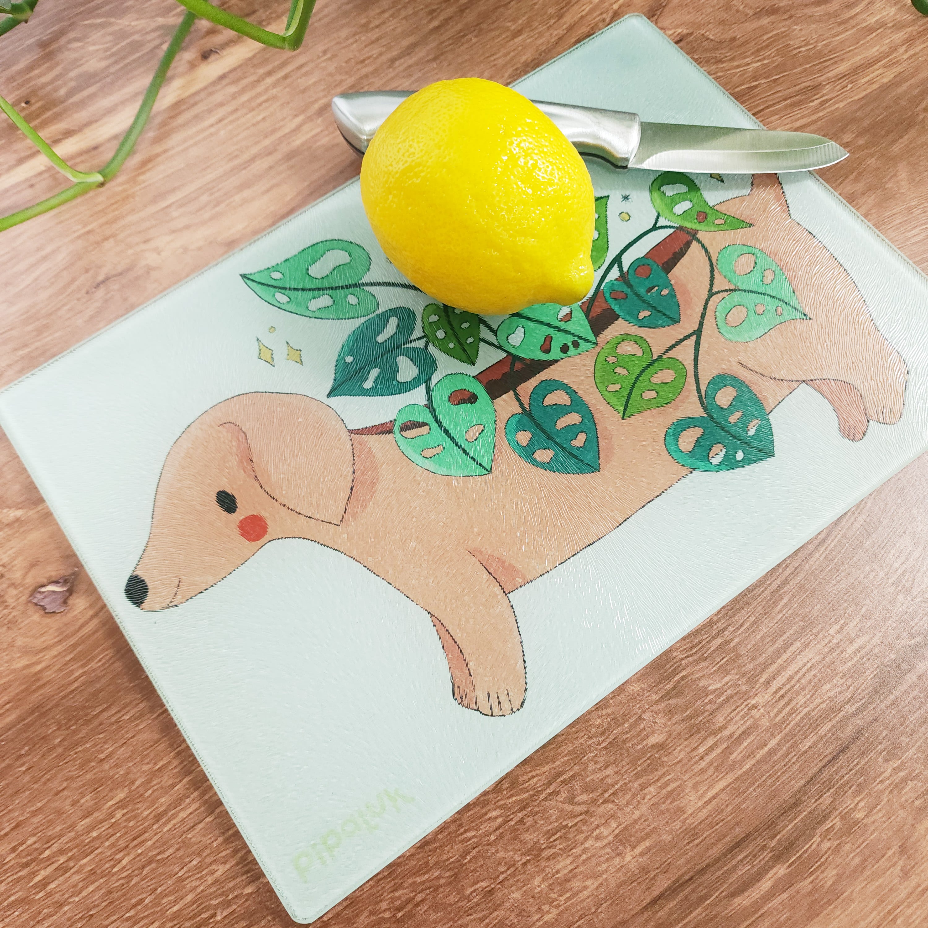 dachshund cutting board with a lemon and knife