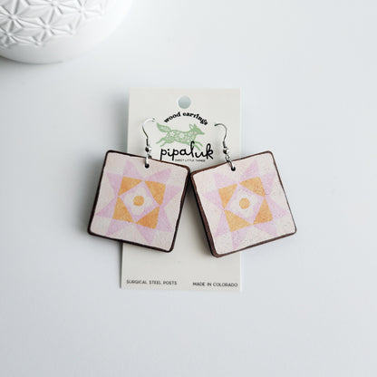 daisy star earrings on a pipaluk earring card on a white background