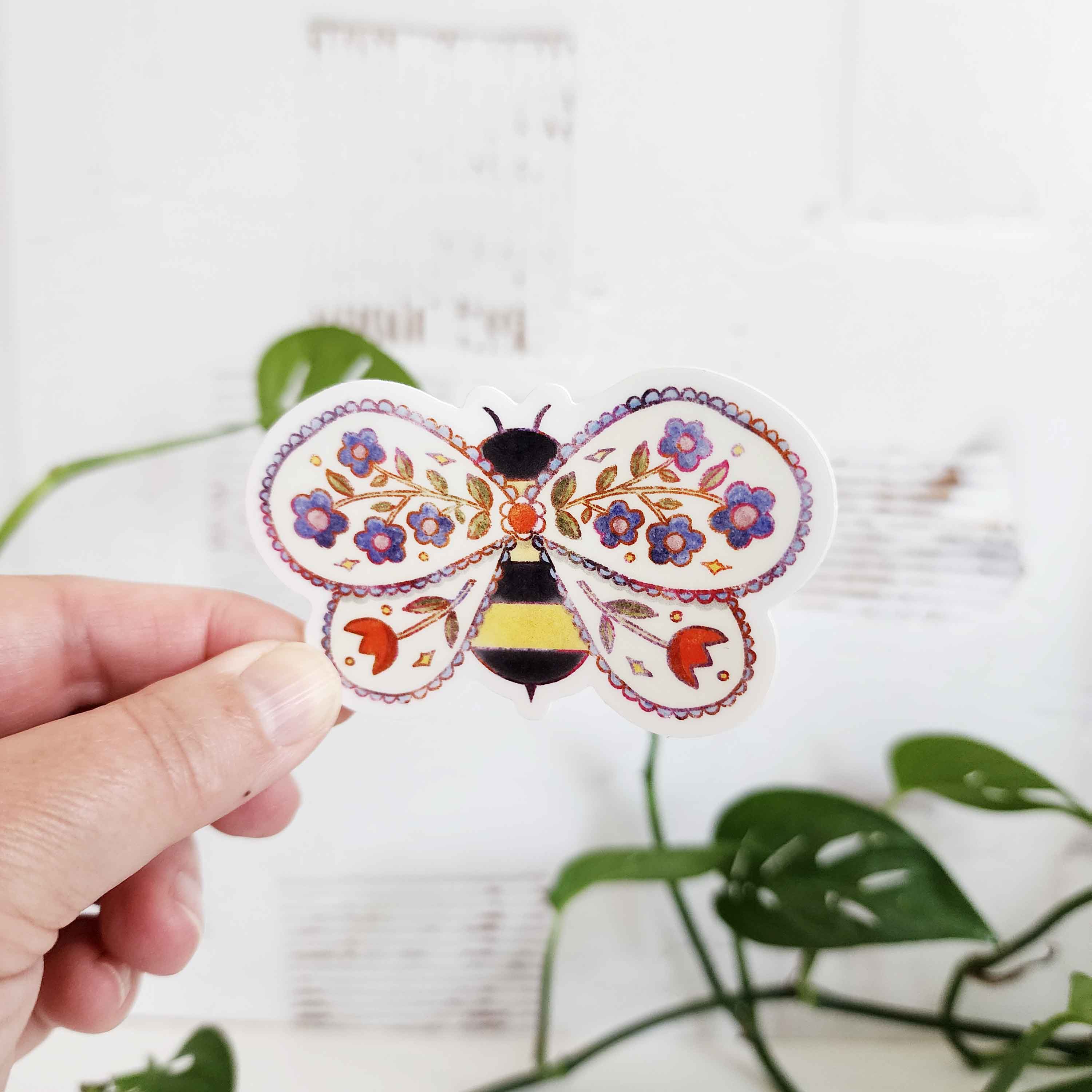 bee sticker with flowers inside its wings