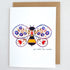 Greeting card with a colorful bee design and floral elements on a white background.