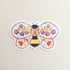 sticker of an illustrated bee with flowers in its wings