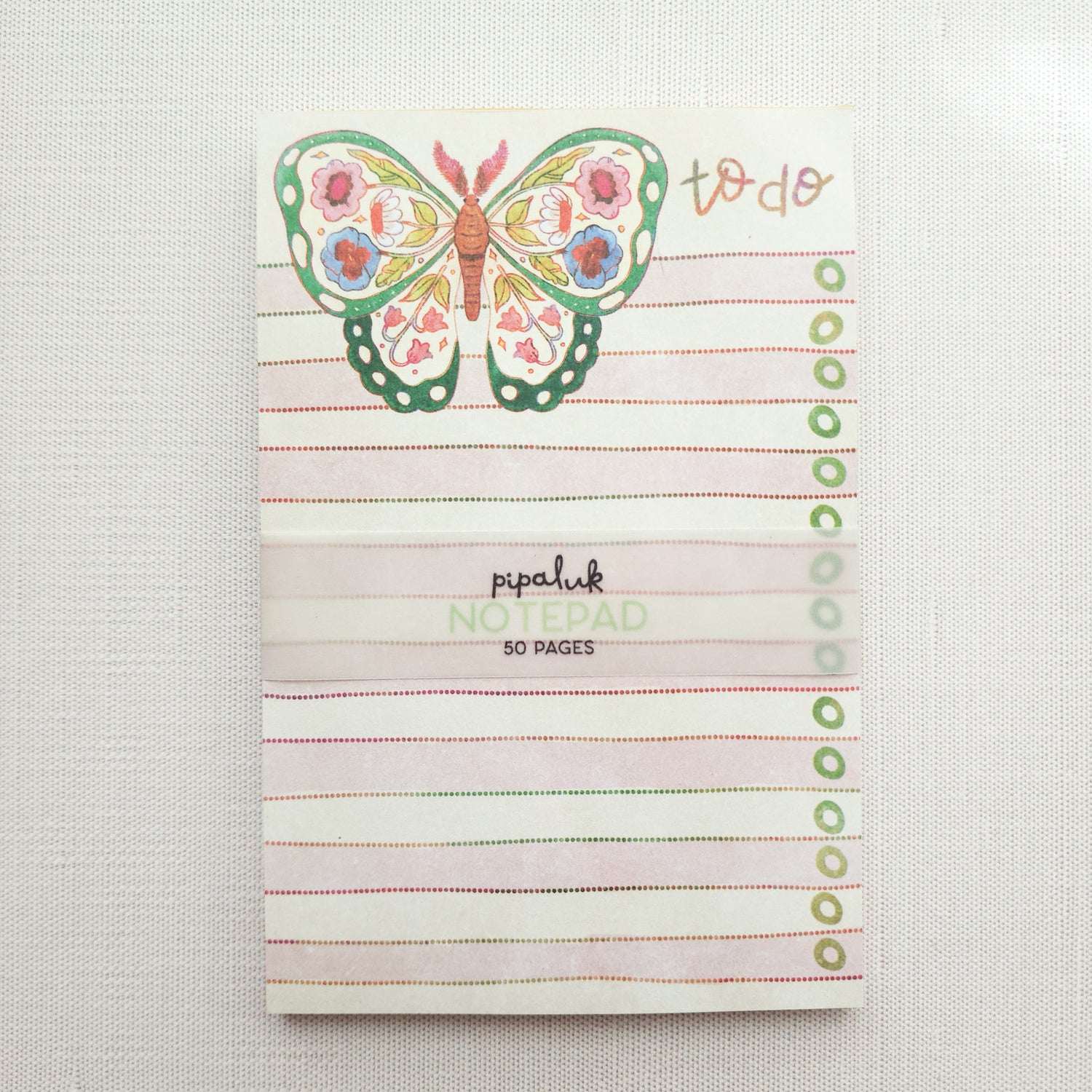 notepad with a floral butterfly illustration and the words to do