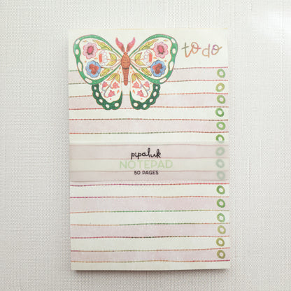 notepad with a floral butterfly illustration and the words to do