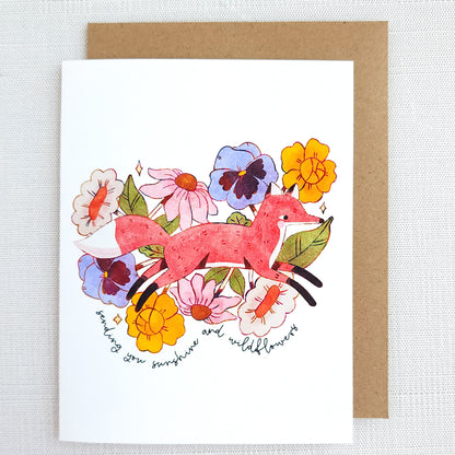Greeting card with a fox and flowers on a white background