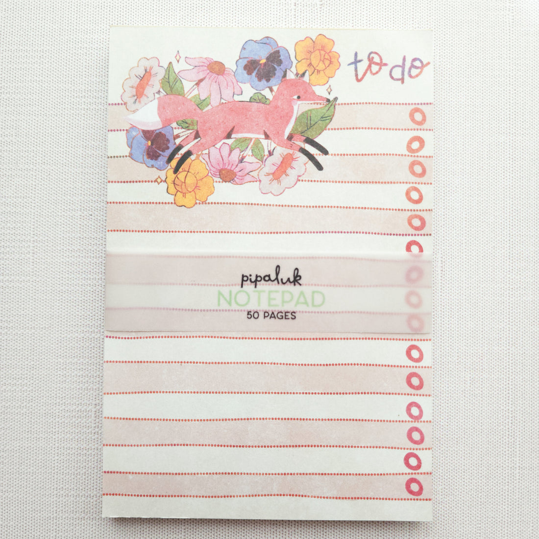 notepad with peach and white stripes and a fox illustration and the words to do