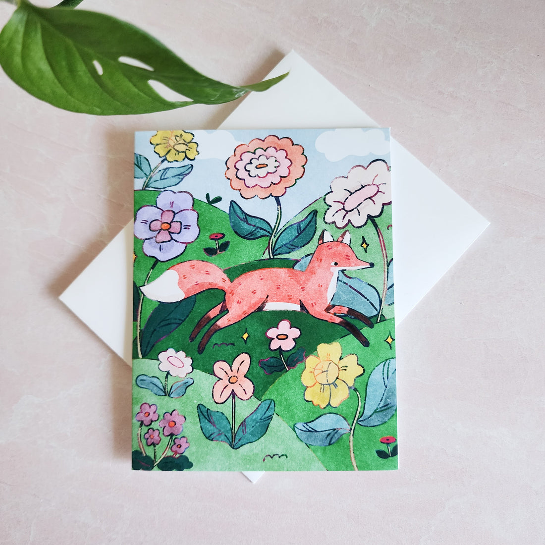 greeting card with a fox illustration on a white envelope