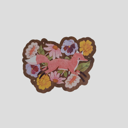 magnet with a  fox surrounded by flowers on a white background