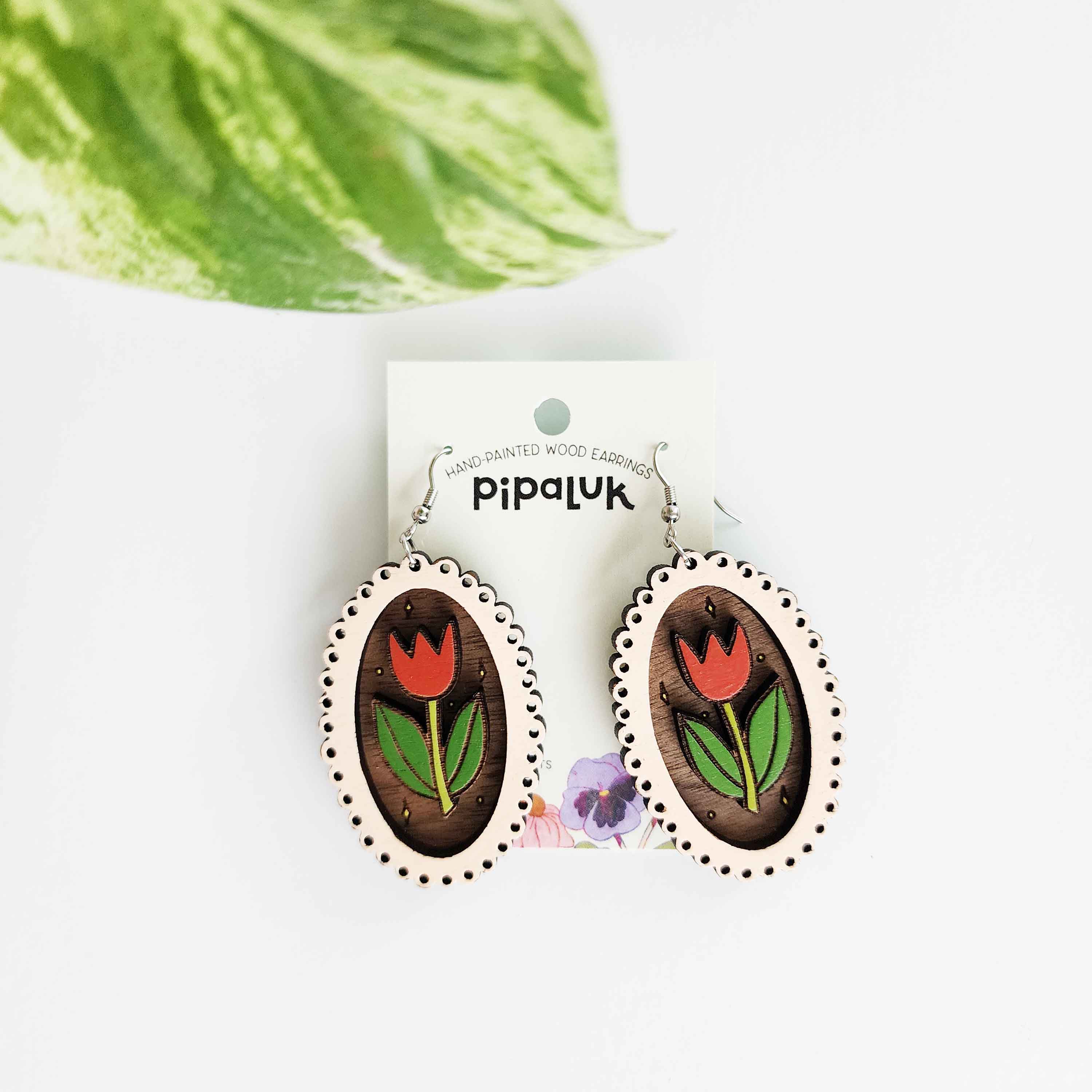 wooden earrings with a pink frame and red and green tulip inside