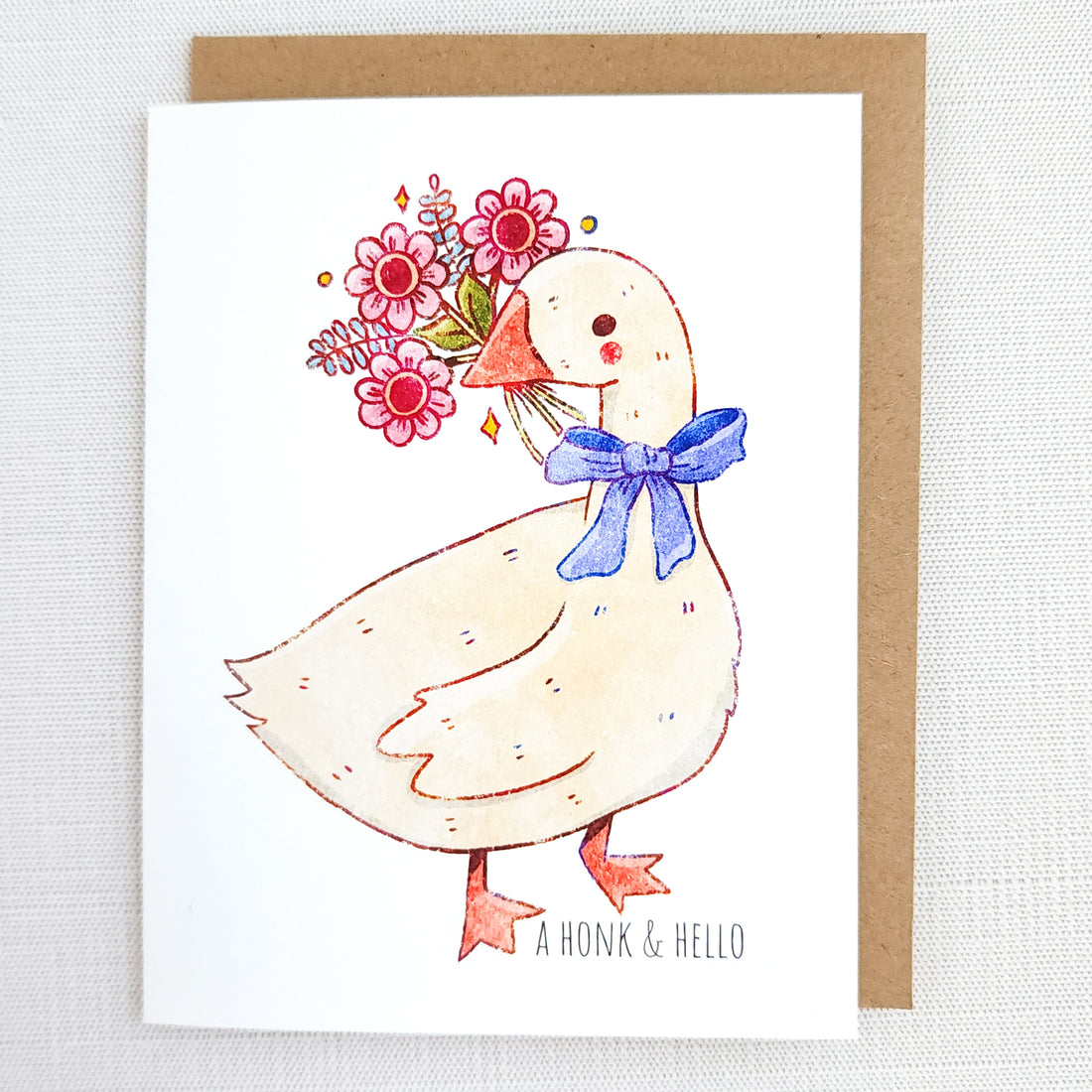 Card with a goose flowers and a blue bow, and the words honk and hello on a textured white background