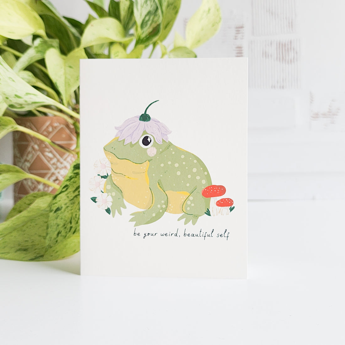 Card with a frog illustration and text &
