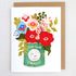 Card with a colorful illustration of flowers in a coffee jar on a white background