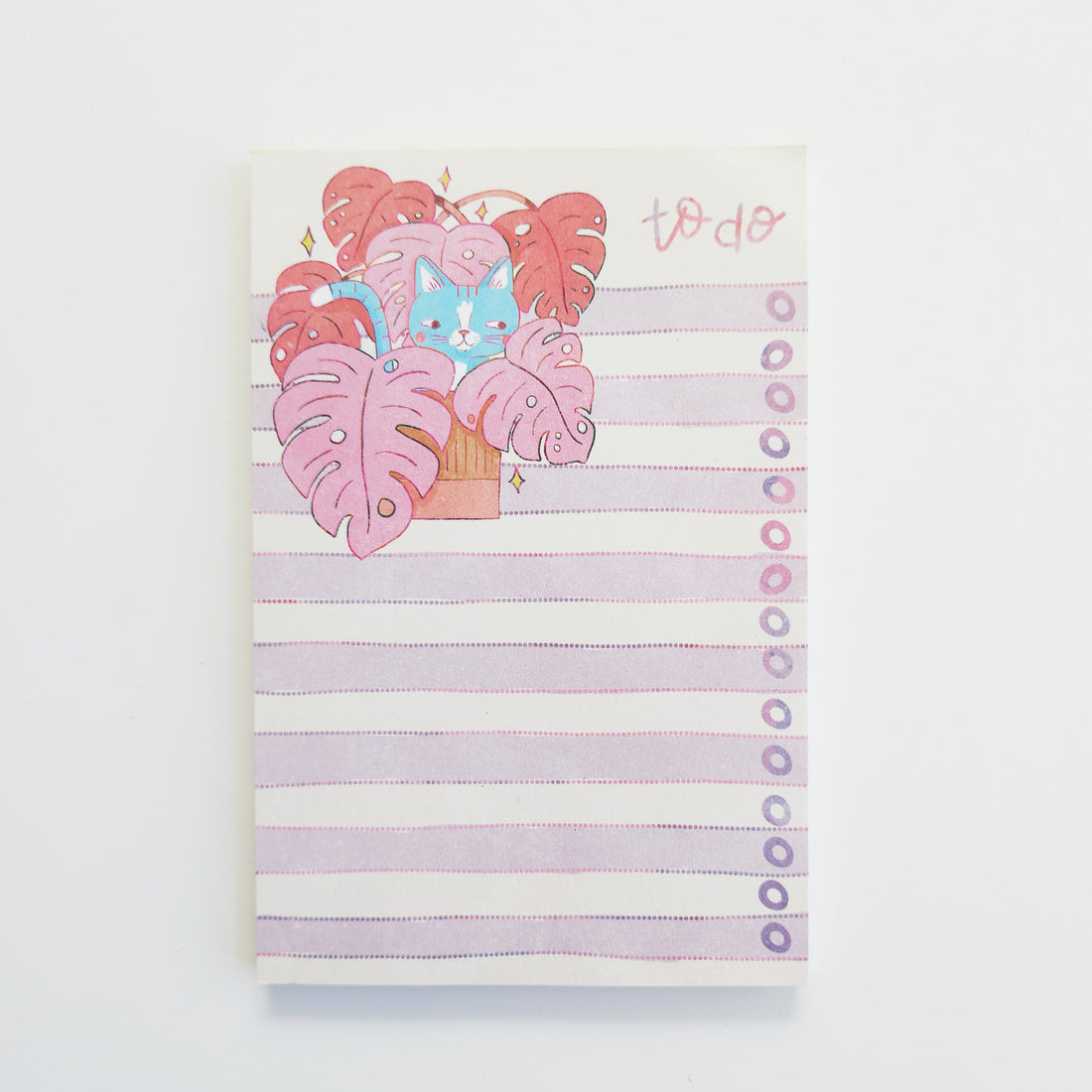 Notepad with a cute illustration of a cat and plants on a striped background
