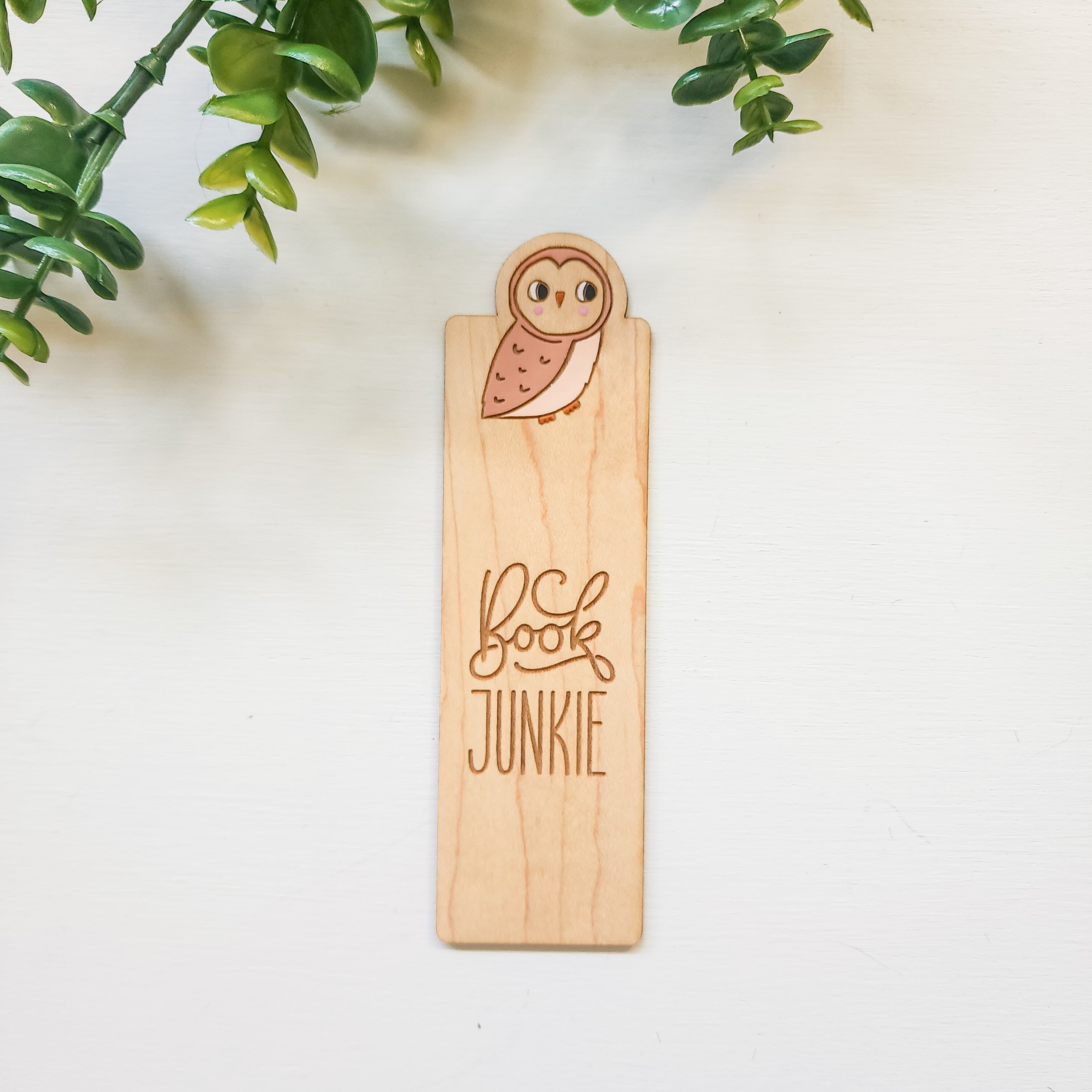 wooden owl bookmarkt that says book junkie
