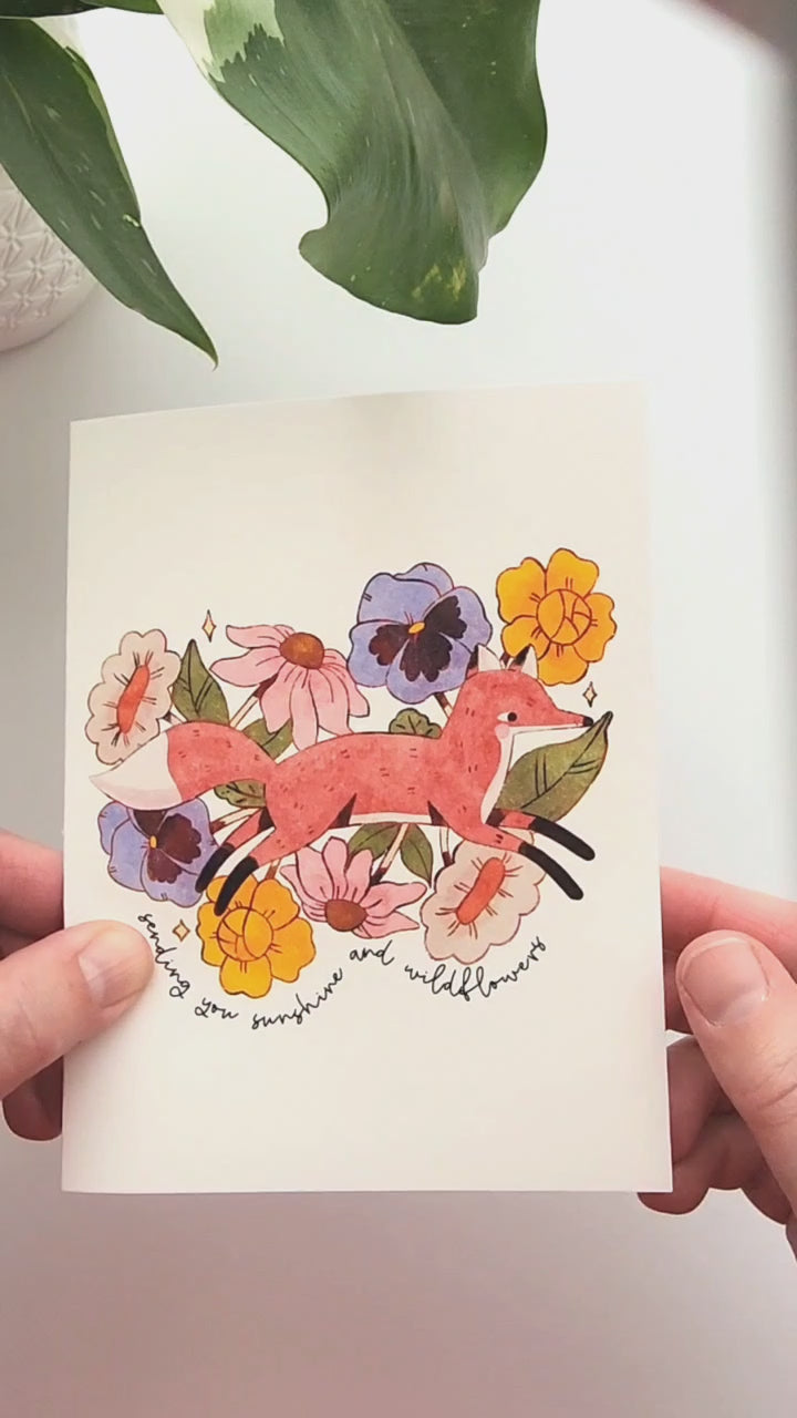 video of a fox in blooms card being opened