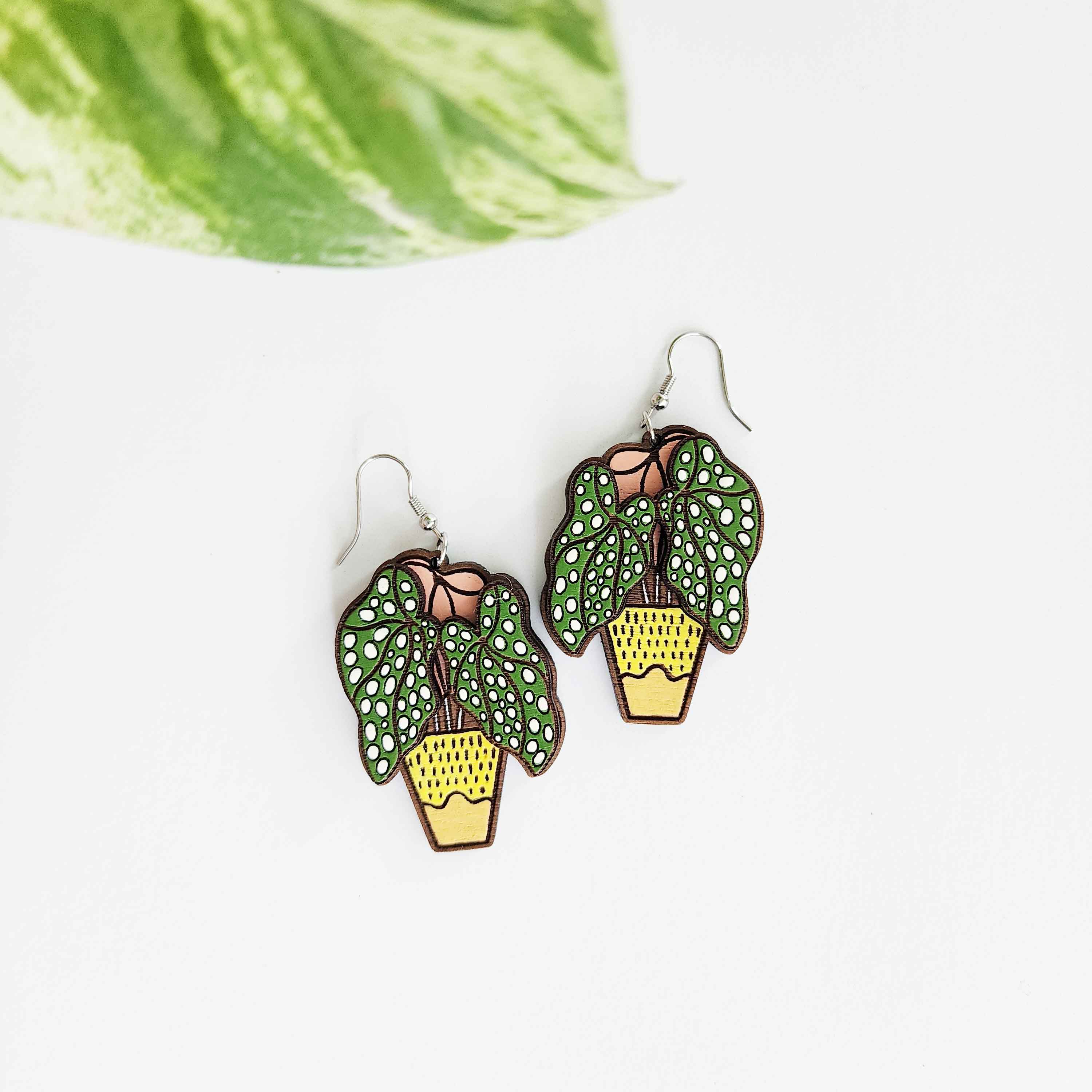 spotted begonia earrings on a white background