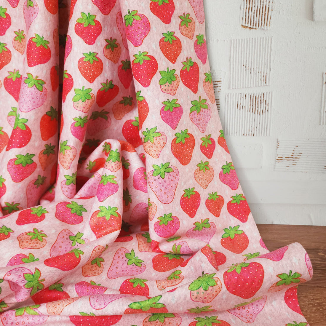 strawberry blanket laid against a white background