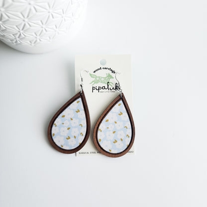 blue floral earrings on a Pipaluk earring card on a white background