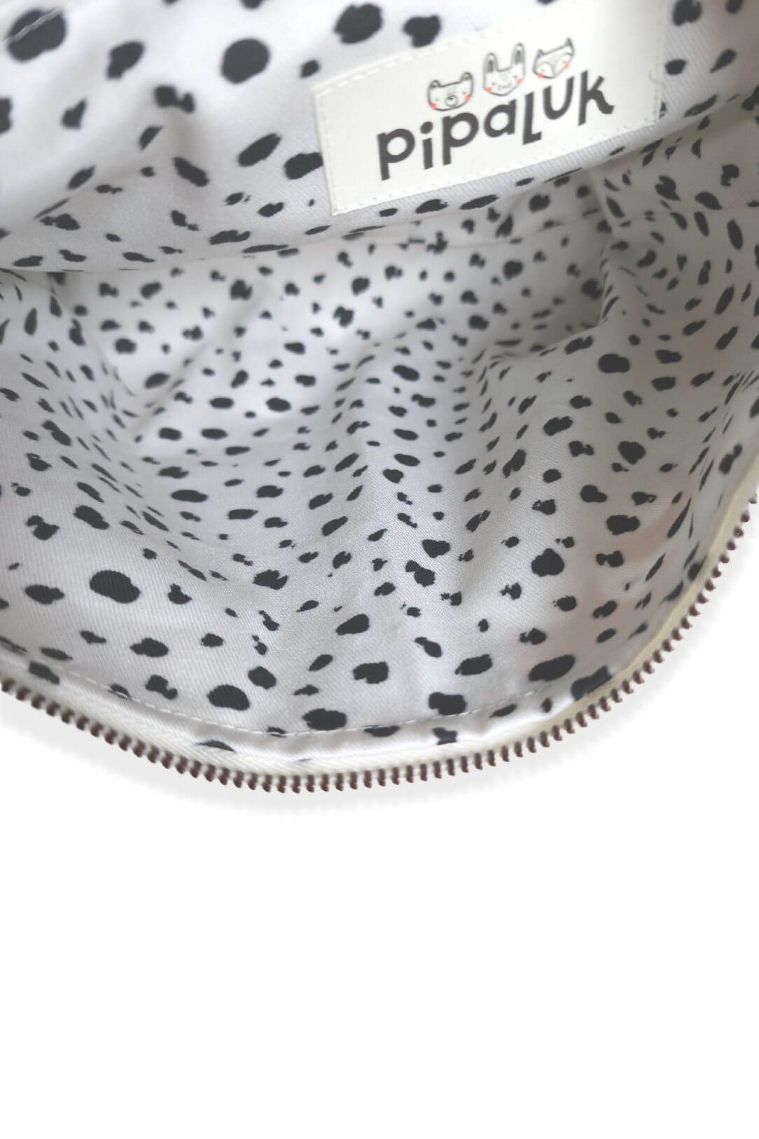 inside of zippered pouch with black and white speckled fabric